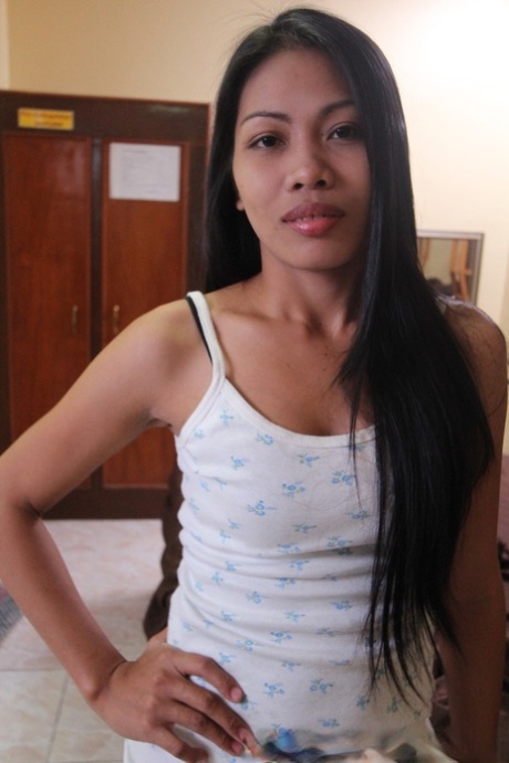 The prostitute Analyn is a Filipina who strips naked on a bed in front of the motel for some sex tourist.