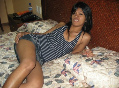 Filipina Amateur Strips To A Strapless Black Bra And Thong On A Hotel Room Bed