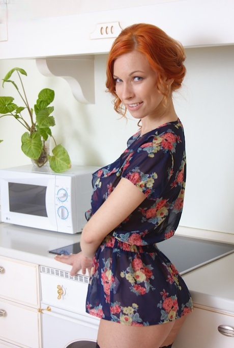 Disguised redhead amateur Daisy Lee in a nude upskirt enjoying her pussy in the kitchen.