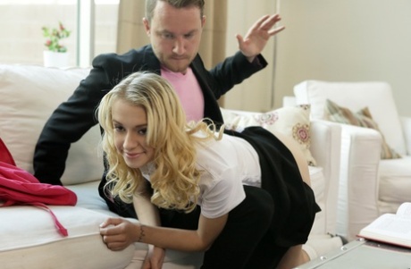 This image shows the skinny blonde getting a spanking before she performs oral sex on her stepfather.