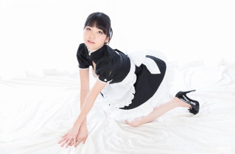 After a handjob is finished, a Japanese maid removes sperm from her fingers through laxation.