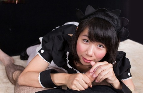 Despite being in uniform, the Japanese maid gives her armband as a POV handjob.