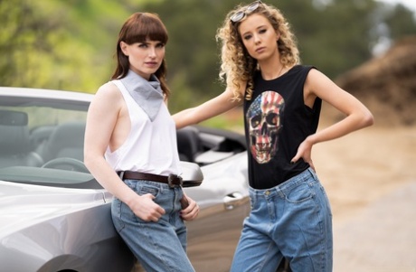 Natalie Mars and Haley Reed are standing together on the side of a desert road