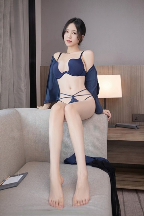 Cute Asian Masseuse Flaunts Her Long Legs In Sexy Underwear & Black Stockings