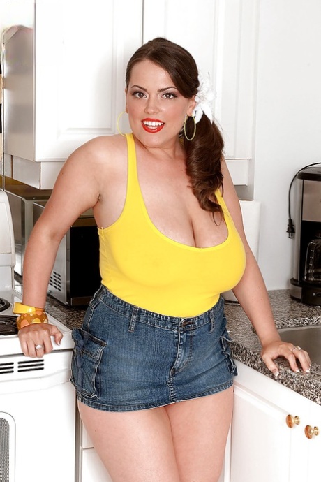 Showing off: Beauteous British woman Taylor Steele modelling fat thighs and anoraks in the kitchen.
