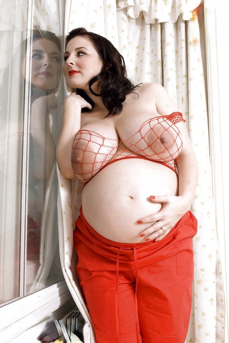 Brunette preggo with fat tits Lorna Morgan posing in fishnet bra and black panties - PornHugo.net