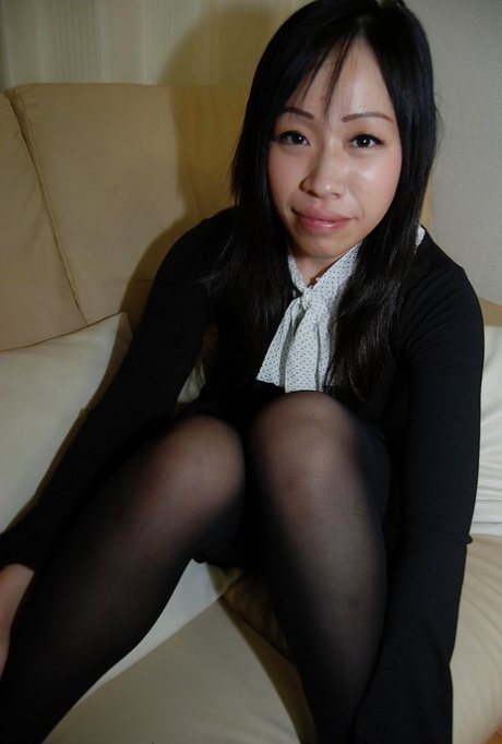 Smiley asian teen in pantyhose getting nude and teasing her hairy slit