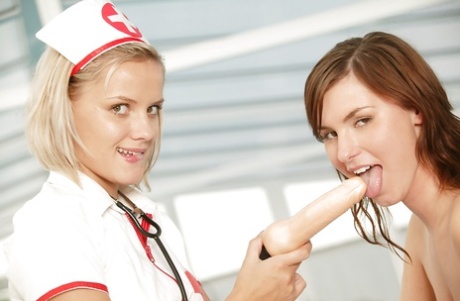 Lusty Teen In Nurse Cosplay Outfit Has Some Lesbian Fun With Her Frisky Friend