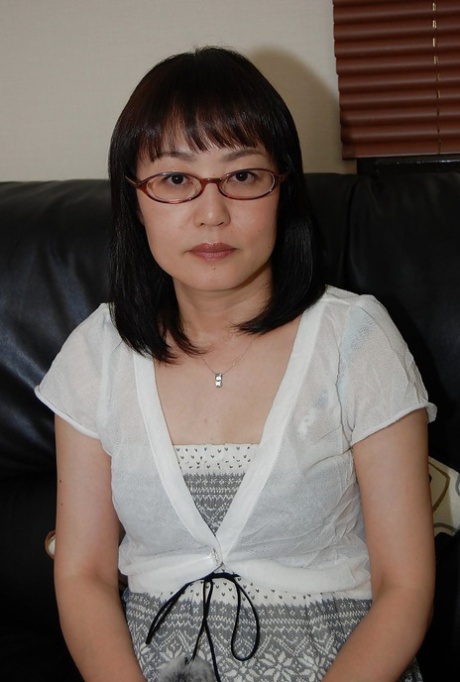 This is an asian girl wearing glasses who strips down and has some fun while having sex.