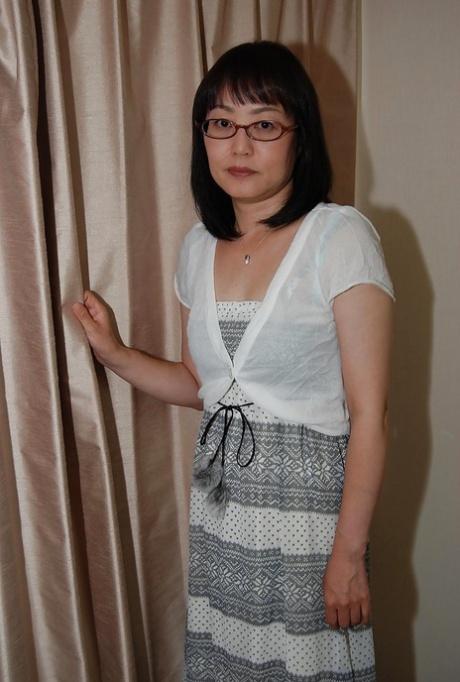 When the shy, Asian lady with glasses bares her legs, she begins to have fun while playing with her pussy.