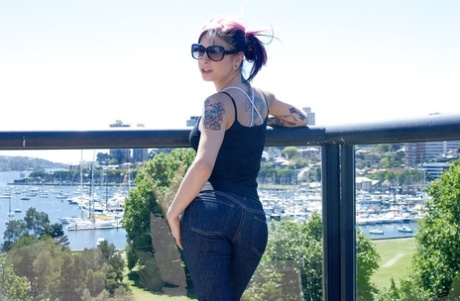 Hot babe Joanna Angel shows off her tattooed body in the outdoor scene