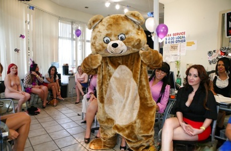 A group of Latina women with a large figure hosting a sensual party at the workplace.