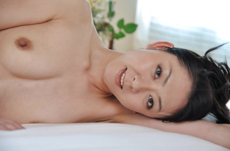 Saeko Kojima, the stunning brunette, is exhibiting her Asian small tits.
