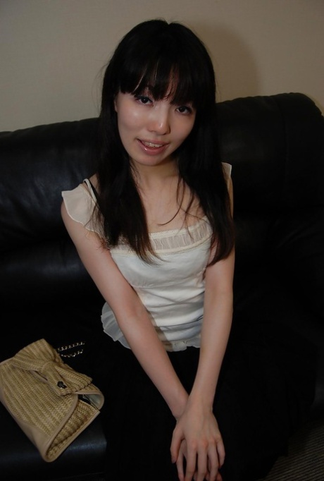 In front of the camera, Idumi Haneda, a beautiful brunette with tiny tits, is seen undressing.