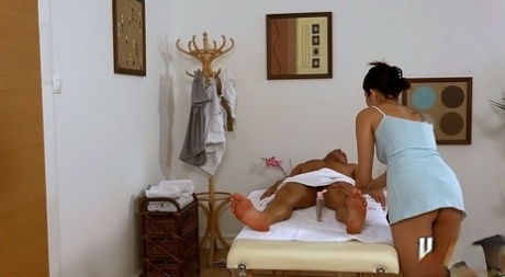 An impressive cock massage is being performed by Miyuki Son, an Asian brunette.