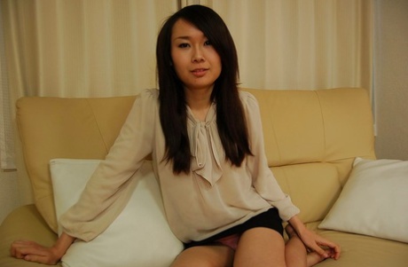 Asian brunette Mayu Takagi displays her tiny tits and buttocks.