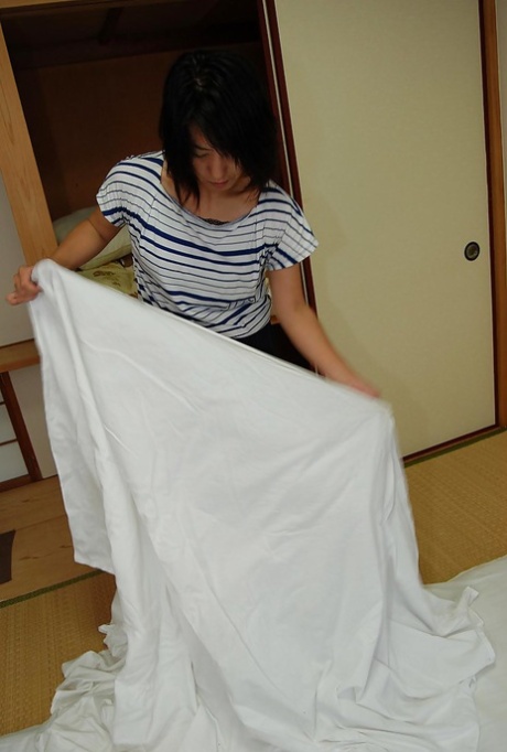 Masako, a beautiful Asian brunette, is set to take a hot shower.