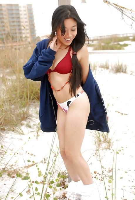 The young lady named Annie Tee enjoys taking off her clothes and wearing lingerie outdoors.