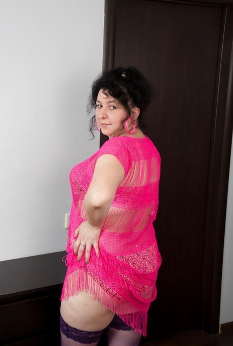 In pink lingerie, the pussy of an adult fat Gulya is shown with marks.