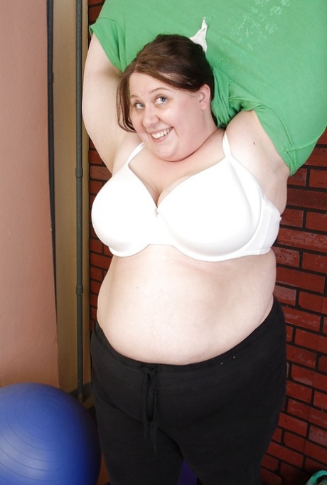 Right after yoga, Jellibean, a fat lady, is seen taking off her dress.