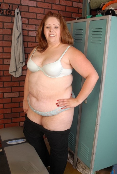 The camera captured Cyn, a fat and mature woman, slowly stripping off in the locker room.