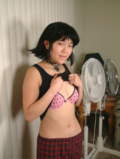Unusual Asian girl with a hairy pussy pose as Cady, an amateur.
