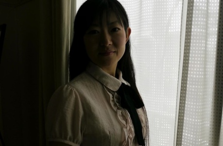 Ayane Ikeuchi, a young Asian female, was seen spreading her pussy in a uniform and pantyhose.