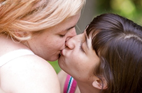 Lossy lesbian women Lulu and Poppy C kiss, pussily lick.