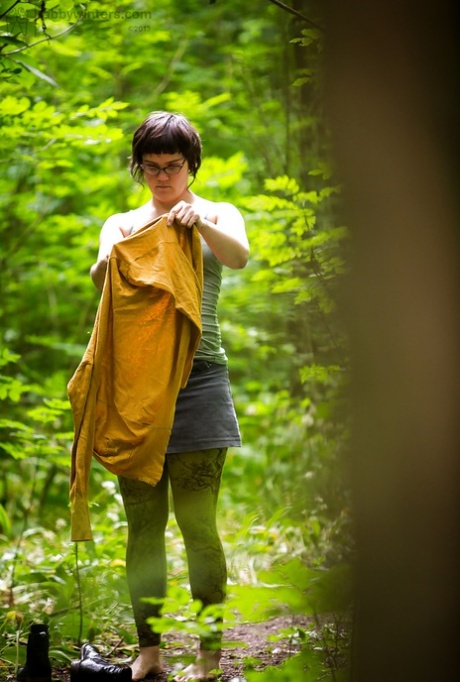 Voyeur Snaps Of Naked Brunette Chick In Glasses Getting Dressed In Woods