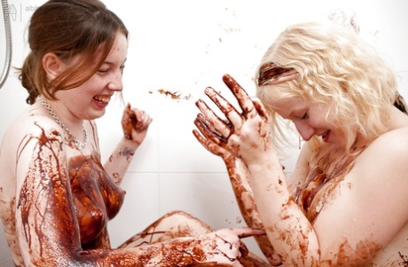 Amidst lesbian activity and wild food, Crystal S and Elsbeth engage in sexual activities while in the shower.