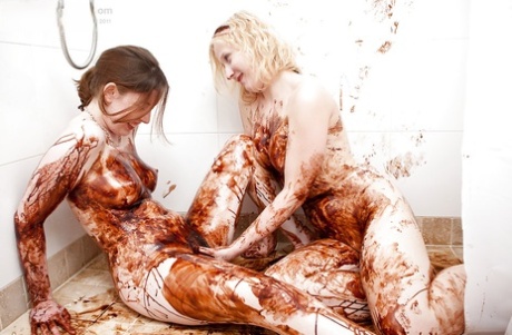 In a shower session, lesbian Crystal S and Elsbeth engaged in wild food eating while having sexual intercourse.