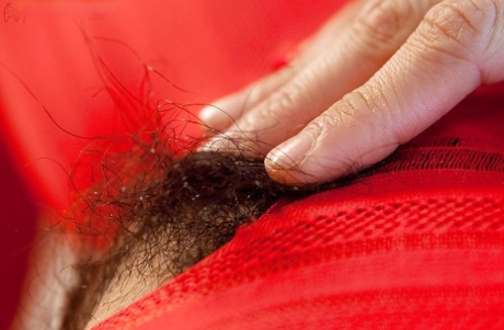 Twyla, a hairy Asian girl, is shown in close-ups while masturbating.