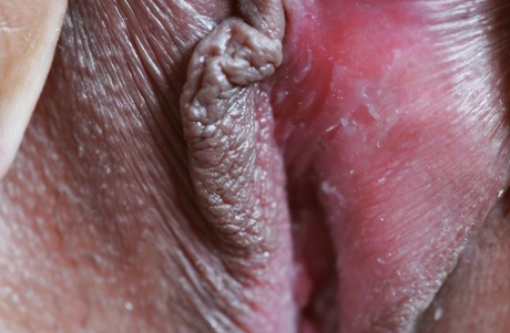 A charming Asian woman, Jenny, delights in fingering her cuntiest hands while fondling perfectly erect lips.