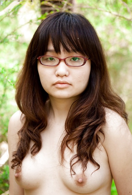 Following a slow-motion removal of hair from her vagina, a small Asian girl wearing glasses exposes her facial hair in an open area.