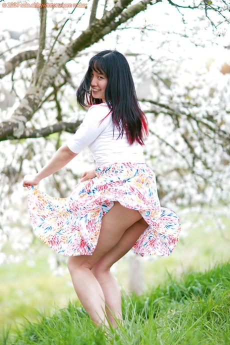 Amateur woman Jenny-Lee sporting nice upskirt under summer dress outdoors