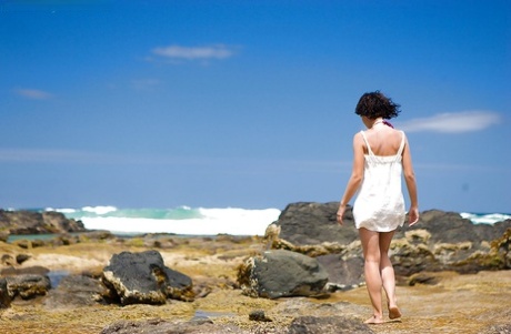 After getting dressed in a modest upskirt, Suzie the amateur lady takes off her bikini for a beach vacation.