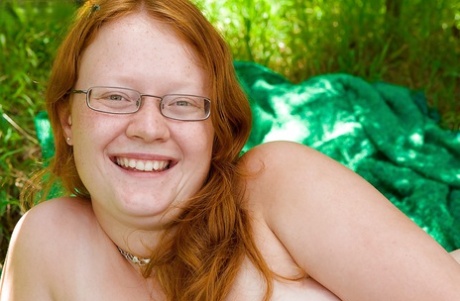 Ugly Redhead Chick In Glasses Strips Naked Outdoors For Pussy Spreading