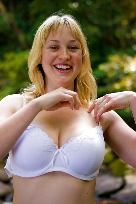 Anneke, a busy and blonde amateur, removes her clothes to exhibit large natural tits.