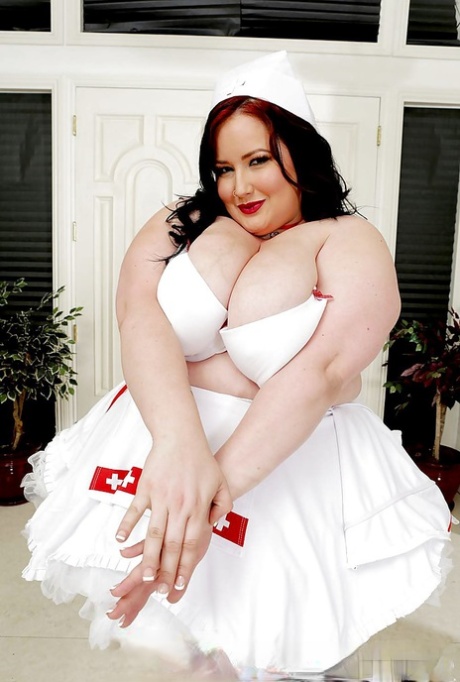 A nurse from SSBBW Eliza is seen wearing heels and an inappropriate nurse uniform.