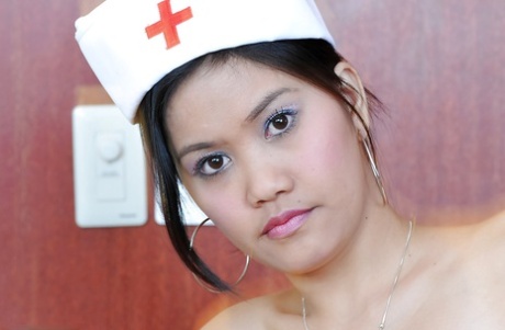 Petite Latina Nurse Joana Lifting Top To Expose Small Breasts