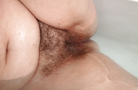 A hairy pussy and flabby stomach are the symptoms that older lady Christina X is experiencing.