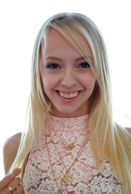 Sierra Nevadah, a young adult with blonde hair, displays her radiant beauty through her nude pussy.