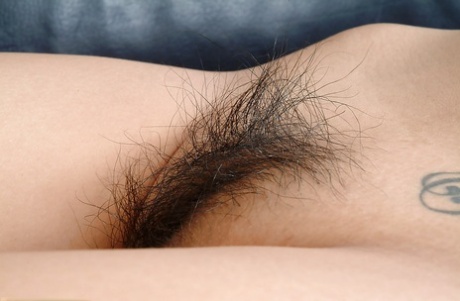 Long-haired Asian amateur, Starlingz, pulling away from the labia with his eyes wide open.