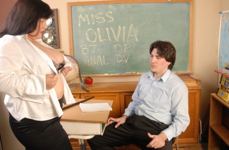 The classroom for grades consists of Olivia, a brunette fat student, tucking her student.