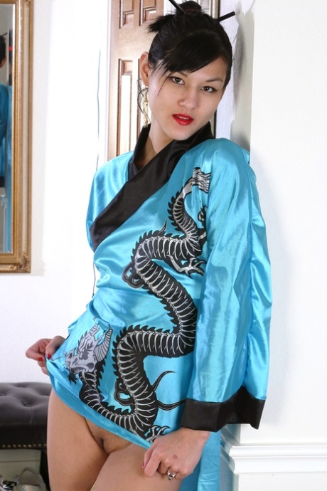 Asian girl in kimono, who is an amateur, spreads her freshly shaved pussy around the room.