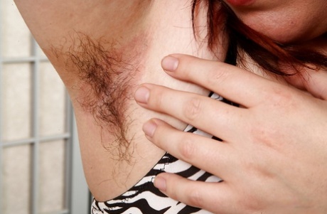 A mature BBW's aroused features, such as their saggy tits and large buttocks, reveal hairy armpits and pussy area.