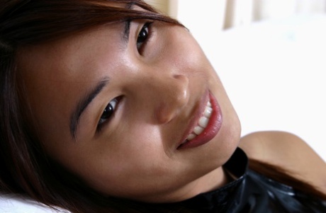 Leggy amateur Asian babe flashing upskirt underwear in PVC dress