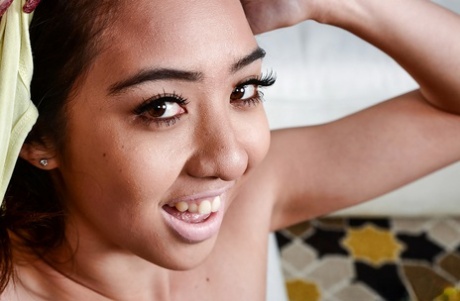 Amateur Asian solo girl, Mila Jade, can be spotted on the verge of spreading her pussy on her feet.