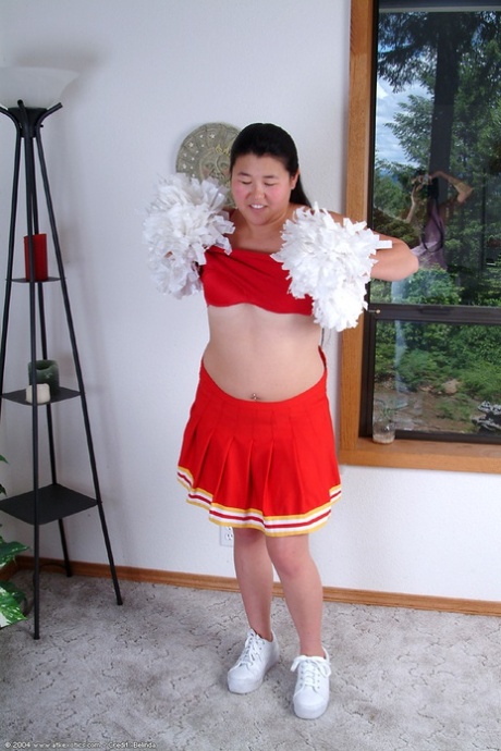 First time contestant Chubby Asian shows off little boobs while shed cheer uniform.