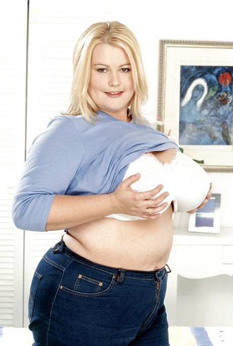 The obese blonde female, known as Lou Lou, displays enormous saggy chest muscles and buttocks.